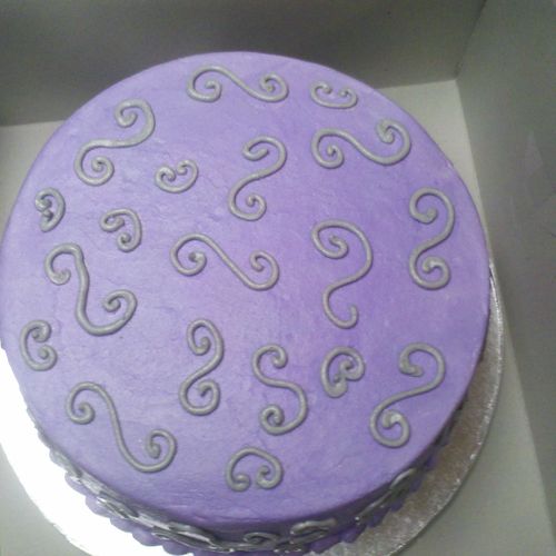 Buttercream cake with silver swirls