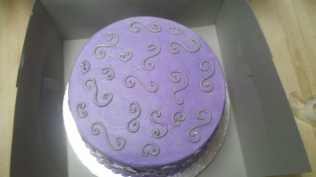 Buttercream cake with silver swirls