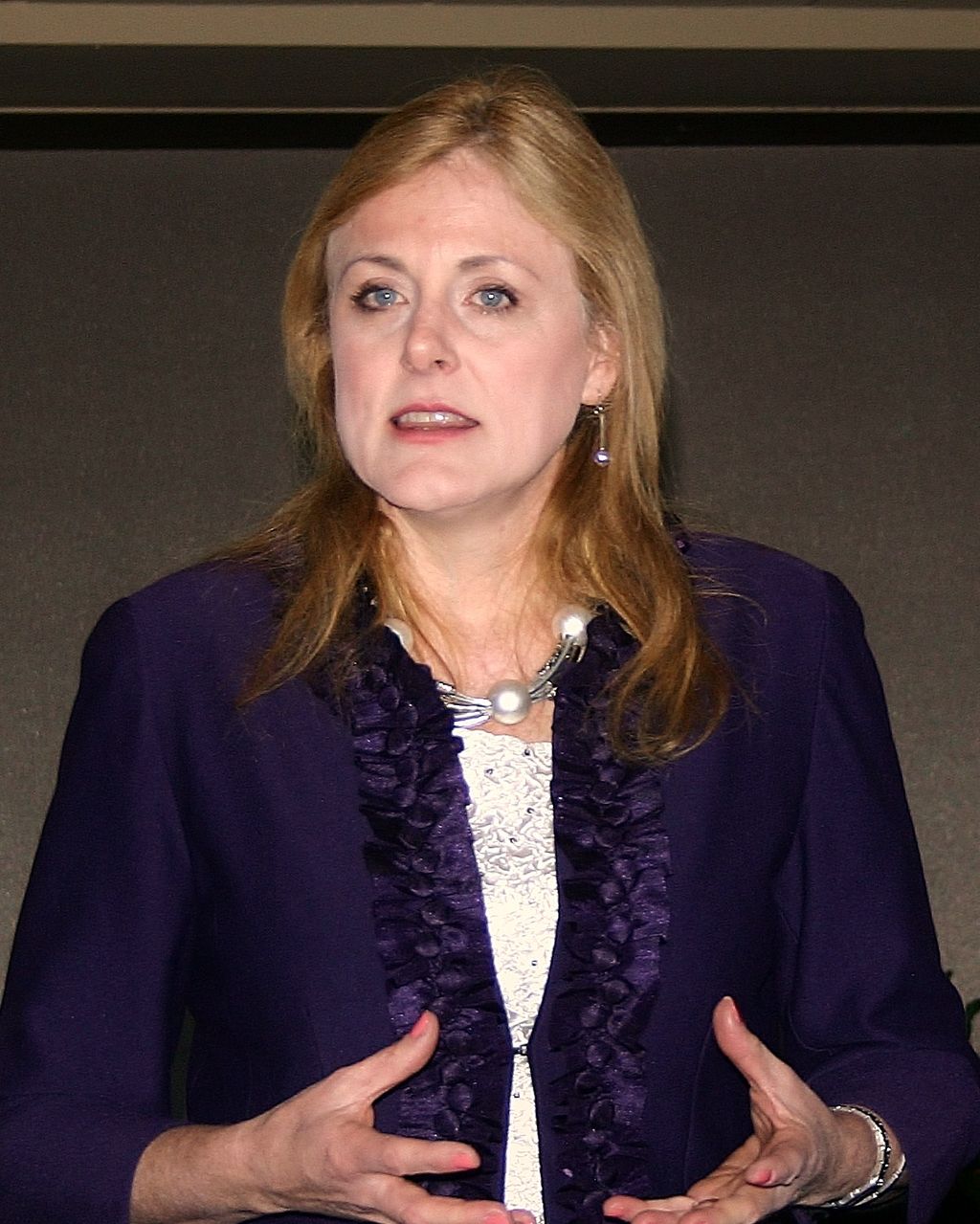 Mary speaking to a group of financial planners