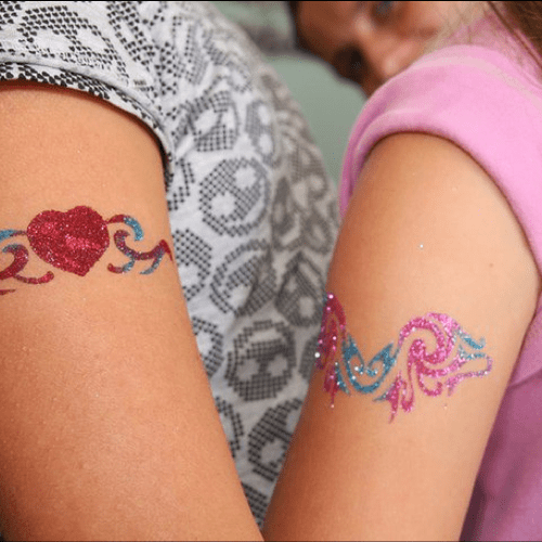 Glitter tattoos using stencils