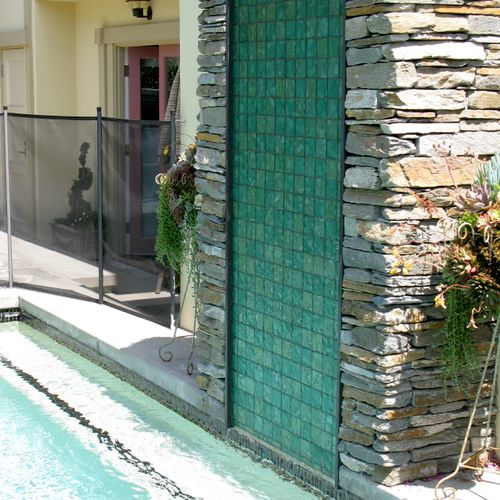 A 36" x 78" glass tile water wall.