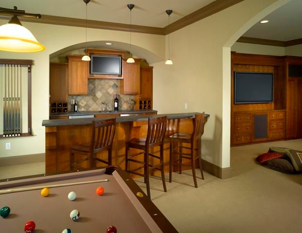 Great bar in the basement remodel by Masterworks A
