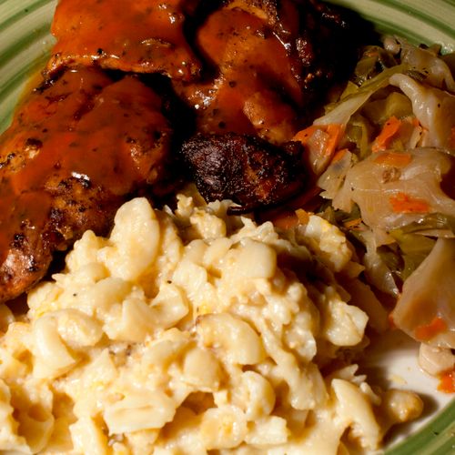 Grilled Halal chicken, mac and cheese, and cabbage
