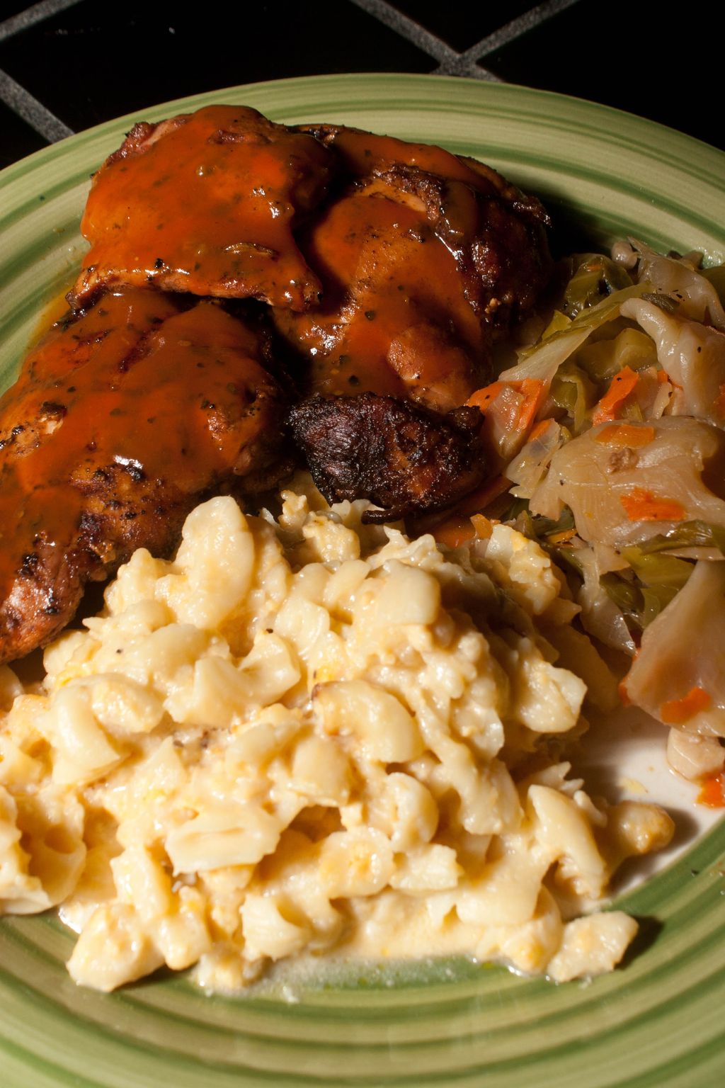 Grilled Halal chicken, mac and cheese, and cabbage