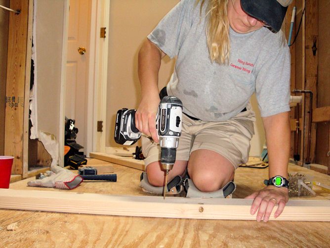 Me building a custom mud shower pan