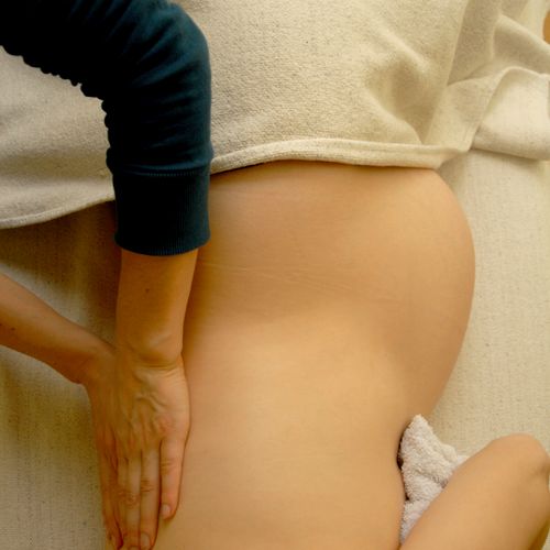 Prenatal Massage can be done lying face-down on ou