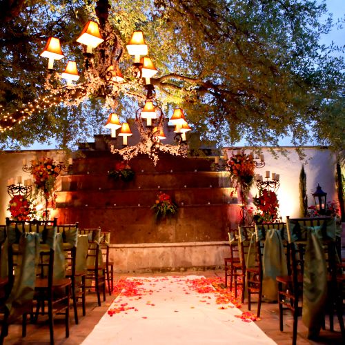 Outdoor wedding ceremony in main courtyard at Vill