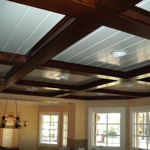 Custom false beams with tongue and groove ceiling.