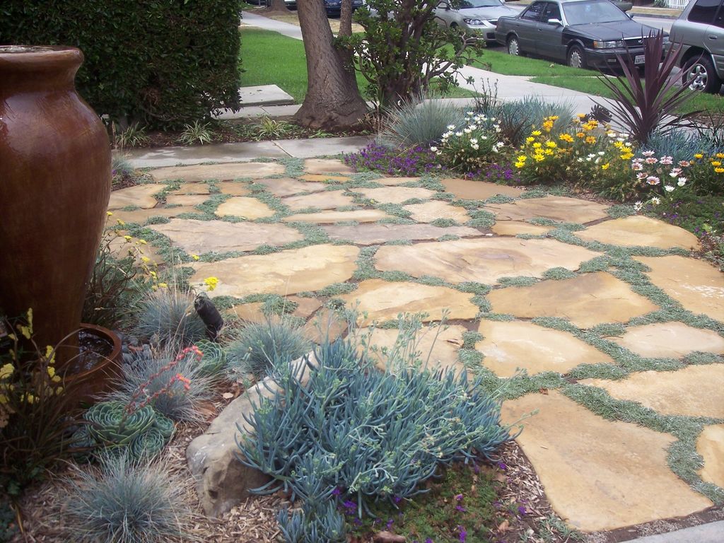 Existing lawn removed. Delicate urn as a recircula