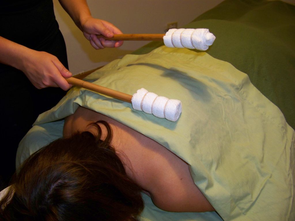 Tapping with Bamboo to finish a back massage.