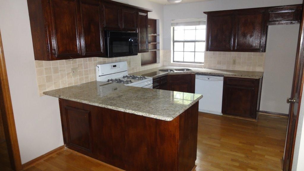 We installed granite and refinished the cabinets
