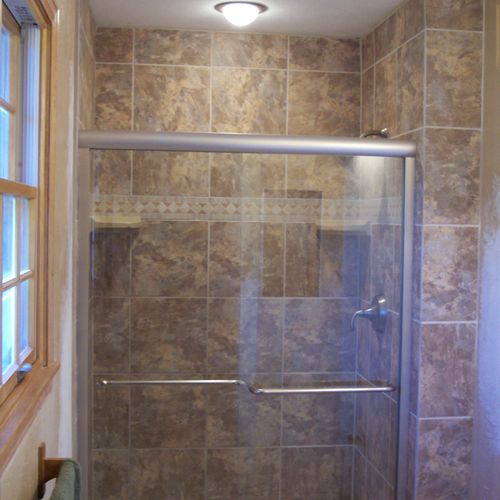 Remodeled shower surround with lighting