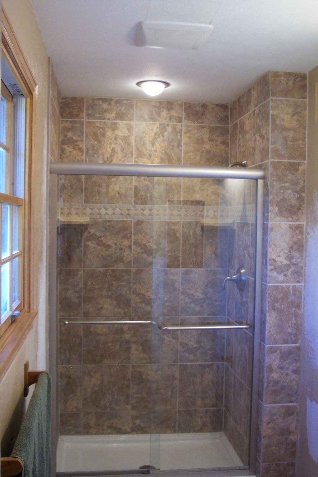 Remodeled shower surround with lighting