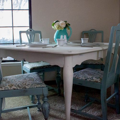Quaint cottage style dining table.  Seating for fo