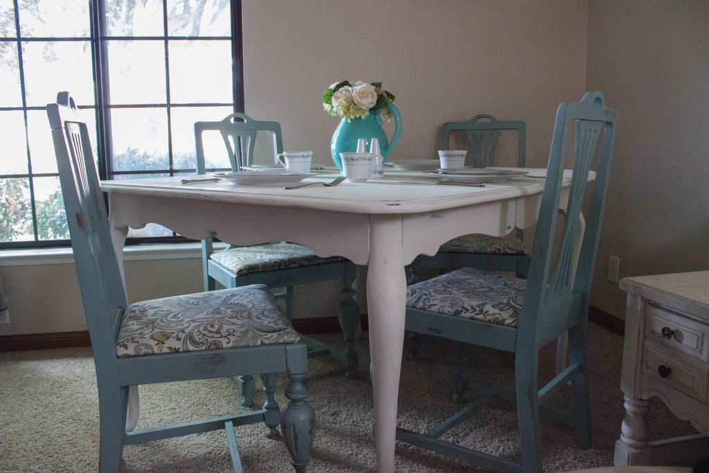 Quaint cottage style dining table.  Seating for fo