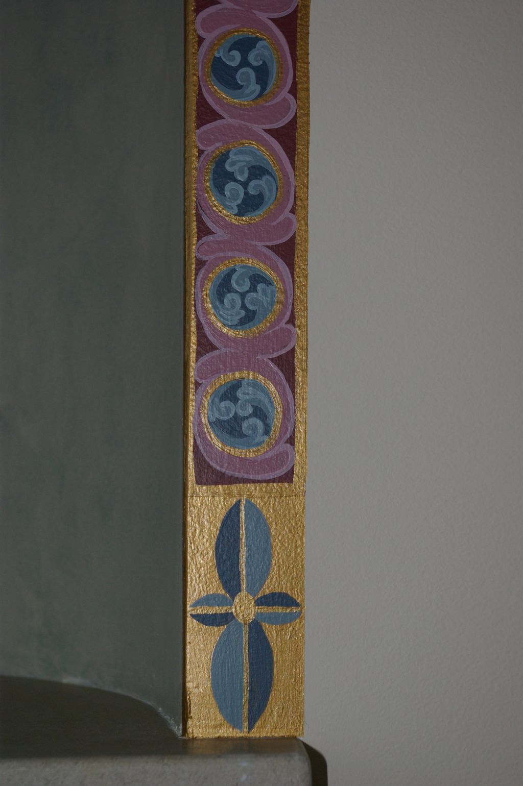 Close up of painted border around niche.