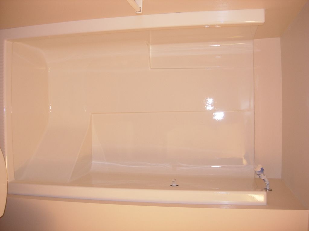 Blue fiberglass shower after refinish