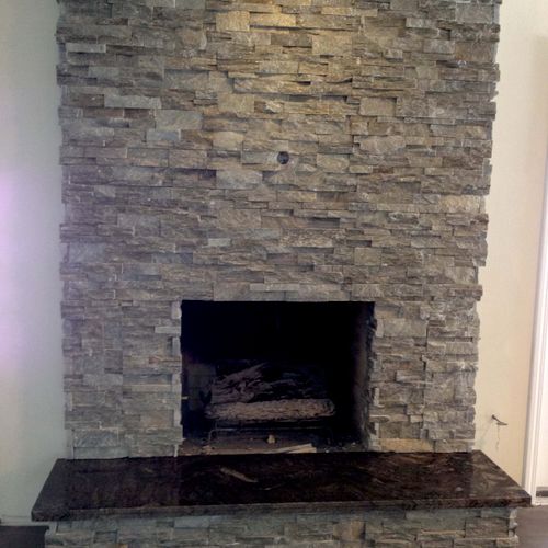 Ledger Stone on wall and a granite hearth