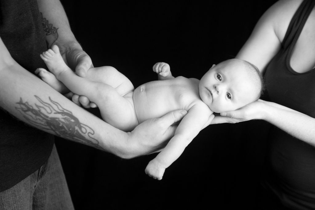 Newborn Shelby photographed with her parents in st