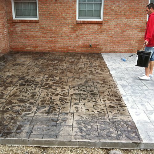 putting the finishing touch on a new stamped patio