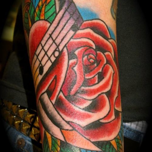 rose and music tattoo by Jay McCaslin