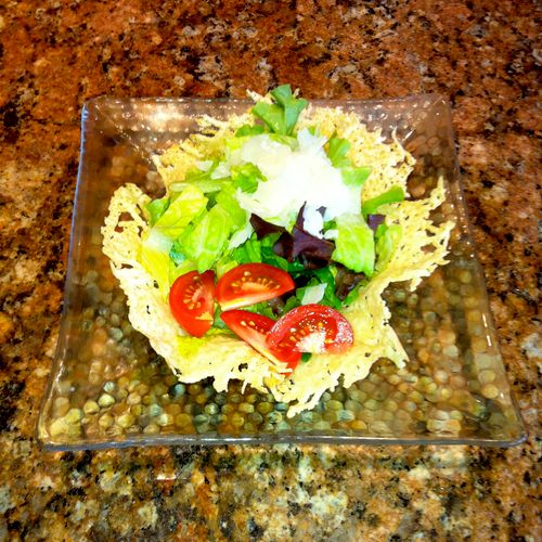 mixed salad in edible frico bowl