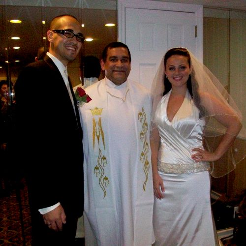 Minister Michael with married couple Jessica and D