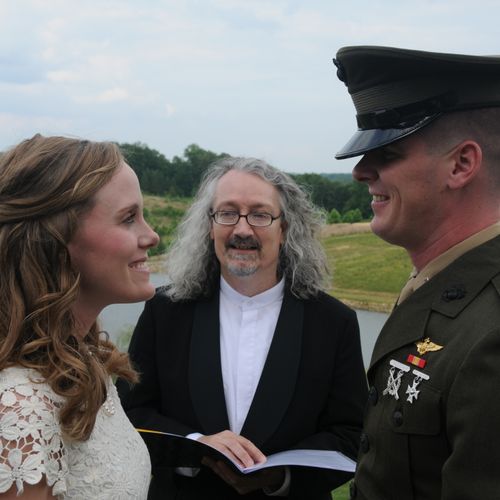 Andrew and Elizabeth, two USMC officers, tie the k