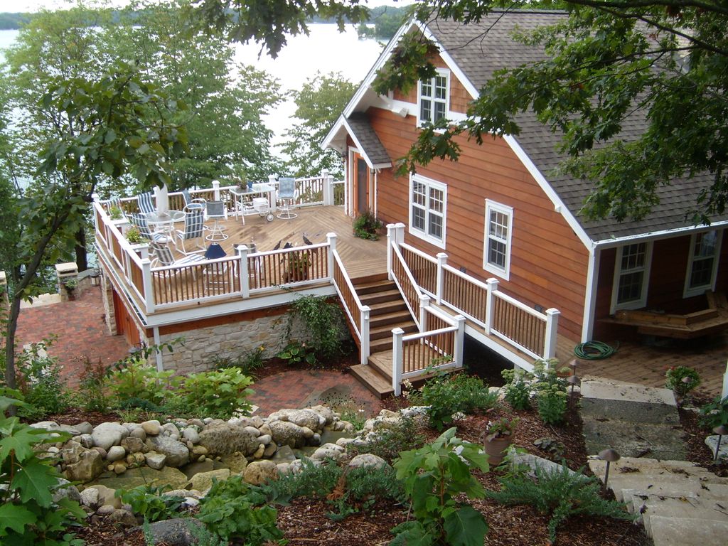 Cedar siding and deck maintained by Pro WoodCare