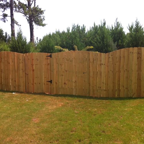 the right side of the arched privacy fence