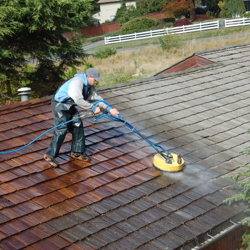 Cedar roof cleaning with jet wash machine
