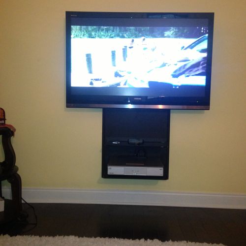 TV installed in a Master Bedroom with a shelf moun