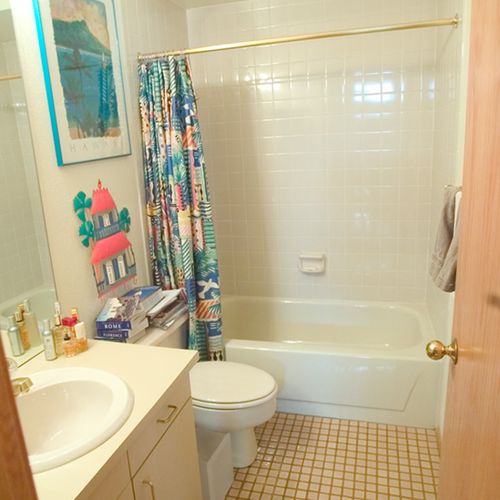 BEFORE: guest bathroom of condo, old 1980's look a