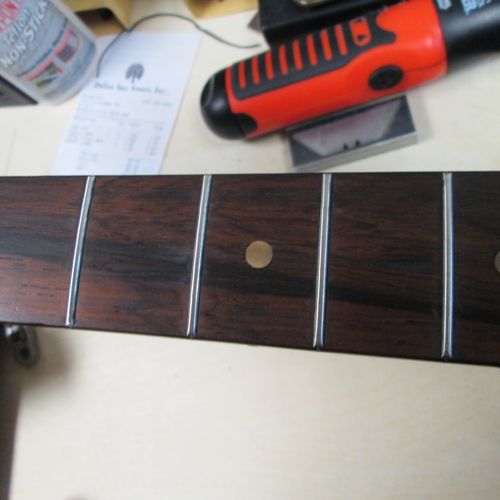 After fret level/dressing/recrowning