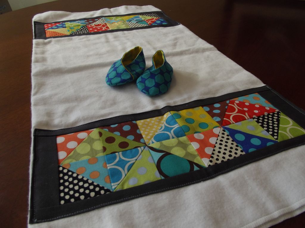 Burp cloth and matching, reversible baby booties.