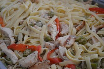 Fettuccine with sauteed chicken, okra, and red pep
