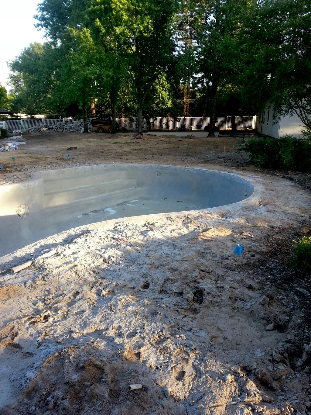 before picture of pool area at Len Residence