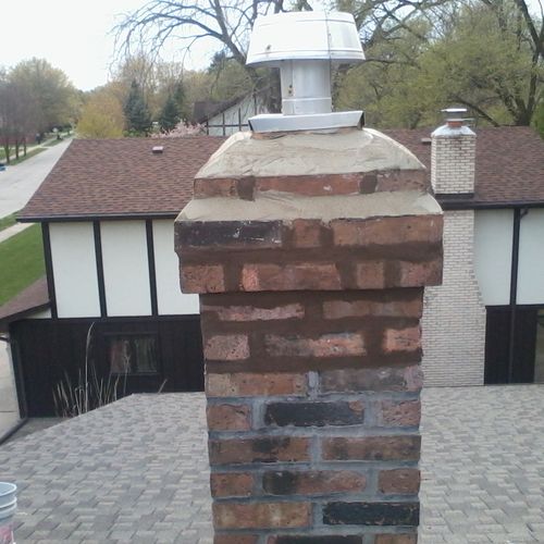 Chimney tuckpointed with color and cement crown pu