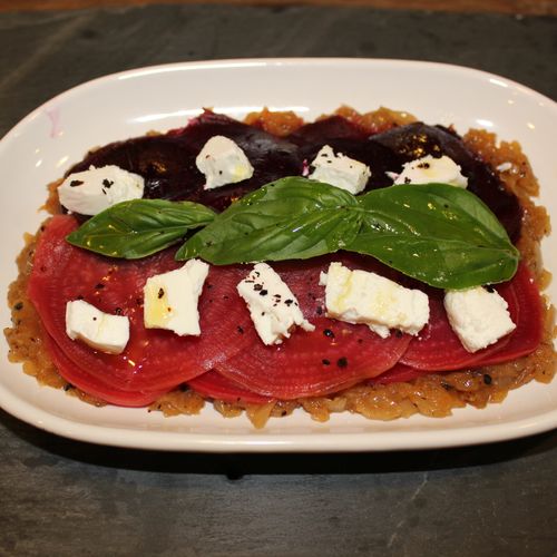 Wood roasted beet carpaccio with goat cheese over 