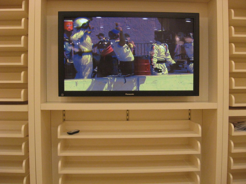 Closeup of TV installation in mall clothing store 