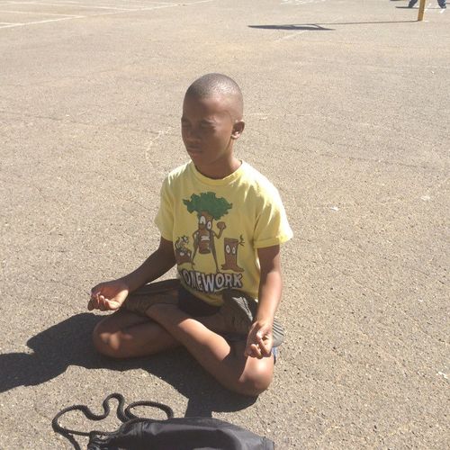 A student meditating before Gung Fu practice.