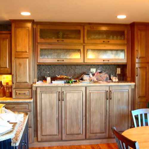 Buffet with higher base cabinets and several pullo