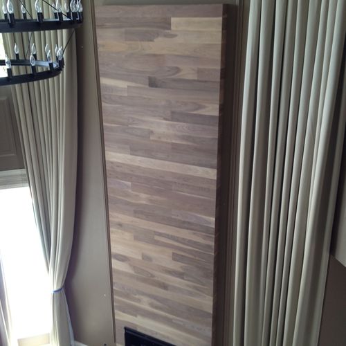 Custom walnut wall piece made and installed by Wel