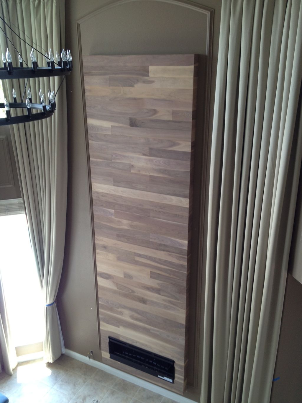 Custom walnut wall piece made and installed by Wel