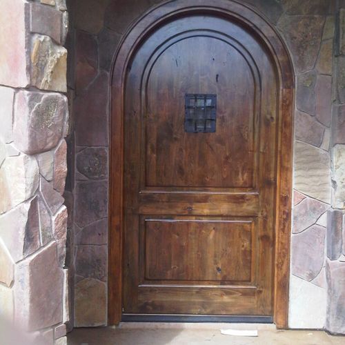 custom radius entry door and stone work