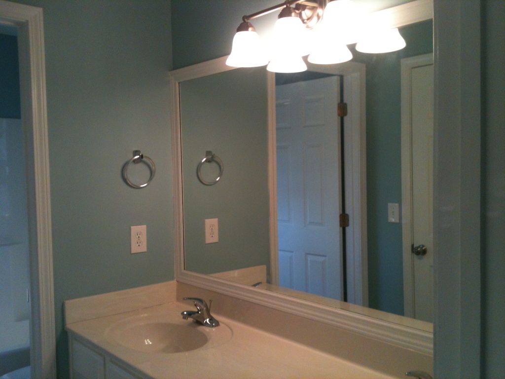 Framed the mirror, painted the walls and mounted a