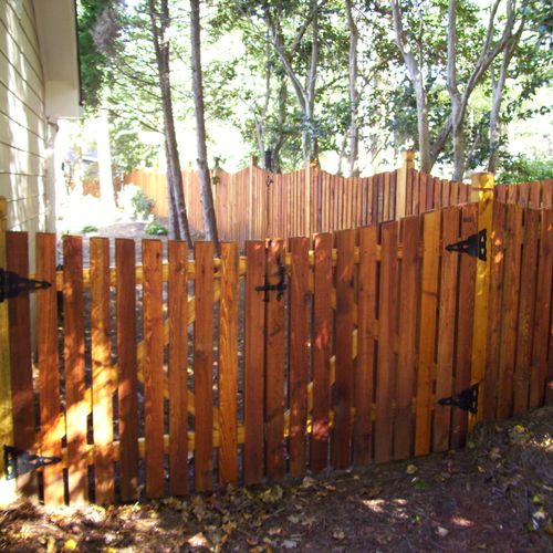 Cedar Picket Fence sealed vs. stained to enhance t