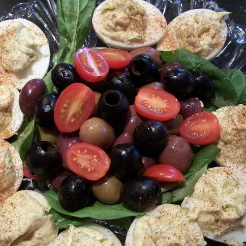 Devilish eggs with grapes, olives, & tomatoes