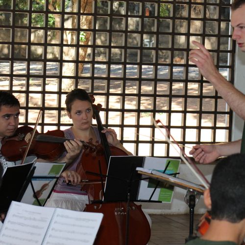 Directing strings at a music camp in Brazil.