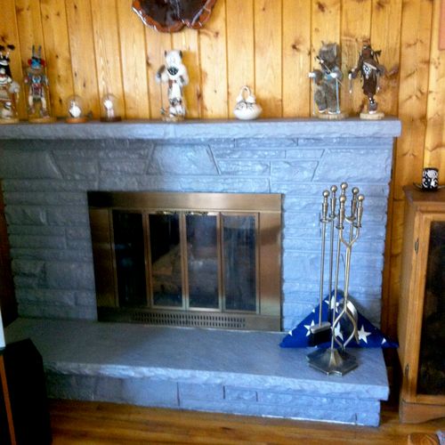 This fire place had been painted a dull grey that 